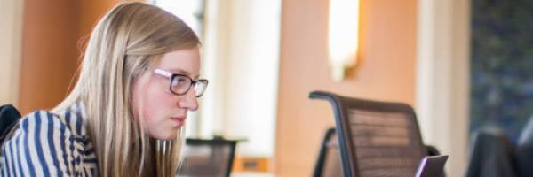 woman looking at laptop